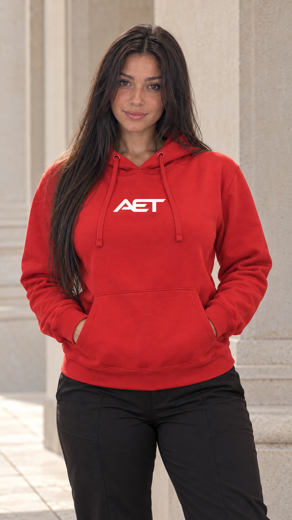 Mila Cruz wearing the AET Core Hoodie in red