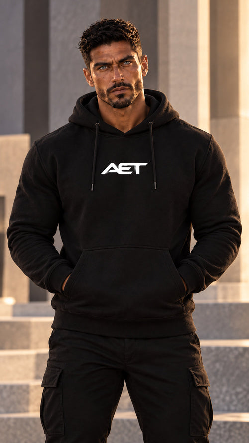 Rael Noir wearing the AET Core Hoodie in black