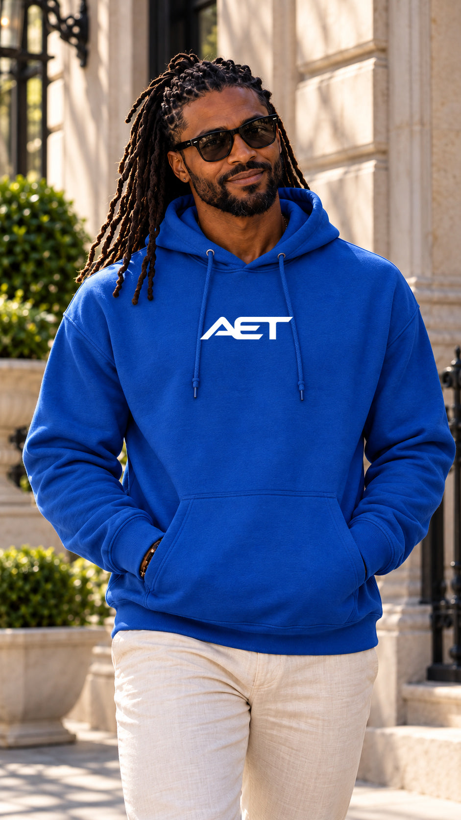 Kael Noir wearing the AET Core Hoodie in royal blue