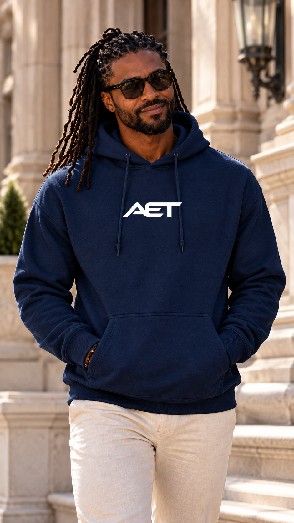 Kael Noir wearing the AET Core Hoodie in navy