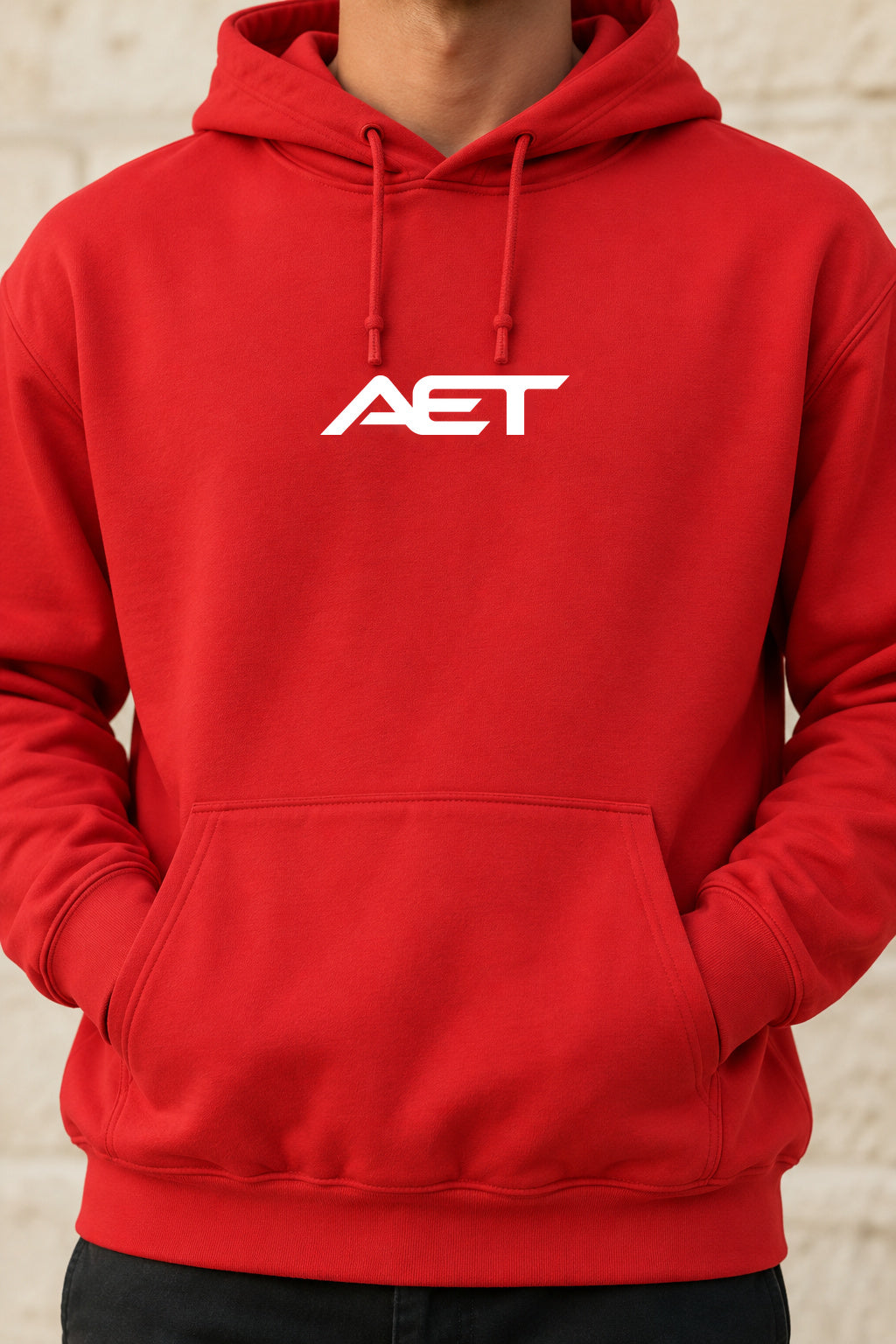 Close-up of the connected AET chest logo on the red hoodie